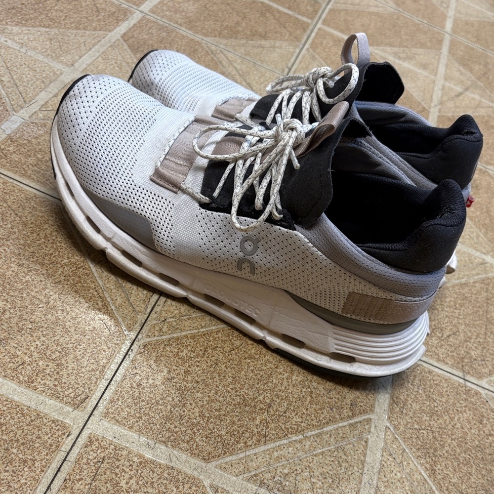 On RunningwoeWhite and Black Sneakers